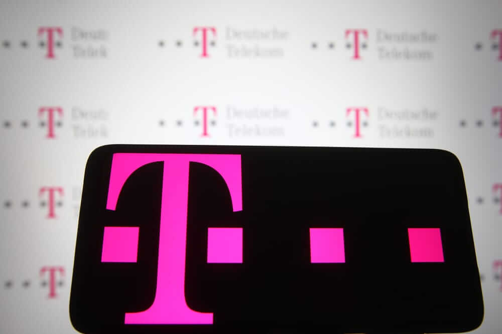 T-Mobile US Inc phone with logo background by- viewimage via Shutterstock
